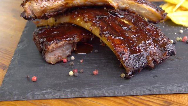 grilled bbq ribs on stone plate