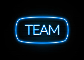 Team  - colorful Neon Sign on brickwall