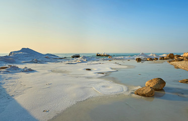 On the shore of the Caspian Sea. The Caspian Sea is the largest enclosed inland water body on Earth by area.
