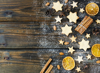 Christmas gingerbread cookies stars on a wooden table and coffe, selective focus