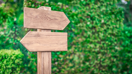 Wooden arrows and indicators on blank for text on a natural background