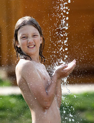 Obraz premium Boy with Blond Hair Washing at Outdoor Shower