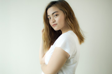A portrait of a woman wearing a white shirt