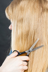Blonde girl makes new hair image.