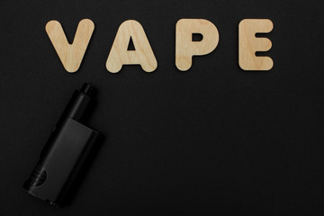 Cigarettes against Vape. Electronic cigarette over a dark background. Popular devices of year -...