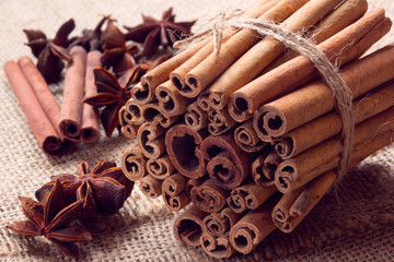 star anise and bunch of cinnamon on a sackcloth