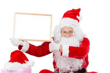 Merry christmas,Santa Claus pointing in white blank sign,Isolated on white background.