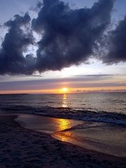 Fototapeta na wymiar Sunset bright sky over water at the Baltic Sea , Estonia