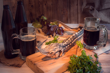 Dried sturgeon with dark beer and greens