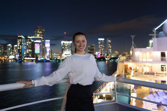 Girl happy smile on skyline night view in Miami, USA.