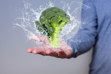 Man Hand Broccoli Water Splashes