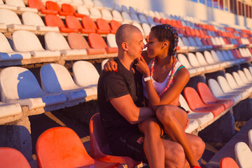 A guy and a girl at the stadium are engaged in sports, lifestyle