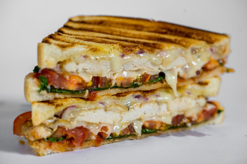 grilled chicken panini with tomato and melting mozzarella cheese