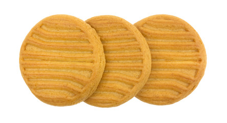 Top view of three sugar free shortbread cookies in a row isolated on a white background.