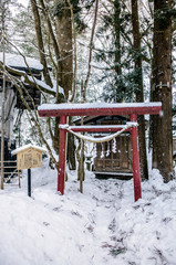 Small shrine in Kakunodate - Akita in winter, snow cover over the town