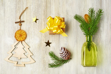 Christmas collection of wooden Christmas toys in the form of a Christmas tree, snowflakes, Christmas tree branches, cones, green bottles, Kraft gift box, orange slice, streamers, coffee