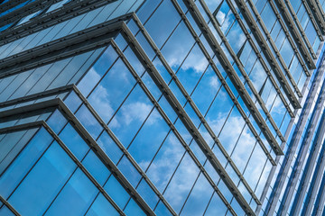 Clouds Reflected in Windows of Modern Office Building..