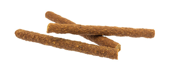 Three beef sticks isolated on a white background.