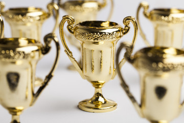 Obraz na płótnie Canvas Gold winners achievement trophy background