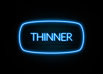 Thinner  - colorful Neon Sign on brickwall
