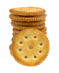 A stack of roasted peanut butter crackers with one in the front isolated on a white background.