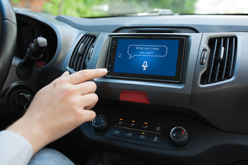 Man hand touching to multimedia system with app personal assistant