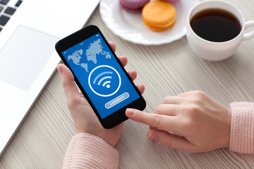 Women hands holding phone application search free wi-fi on screen
