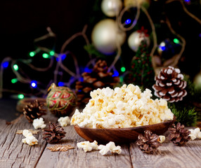 popcorn on the background of Christmas and New Year's decorations, selective focus