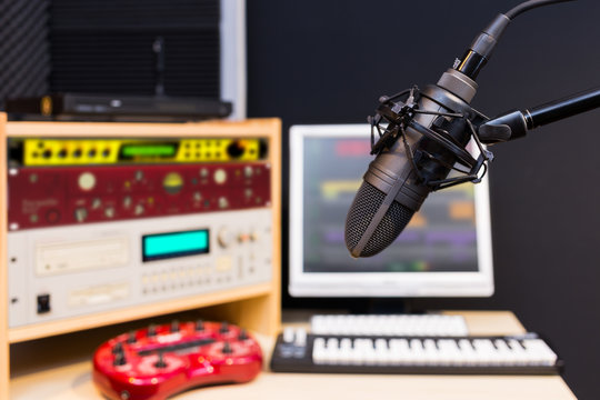 condenser microphone in digital recording, broadcasting studio background