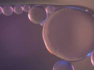 Drops of oil floating in water.