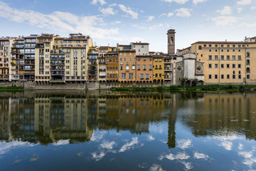 Fototapeta na wymiar Florence cityscape view reflex to the Arno River.