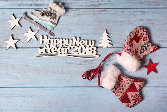 Happy 2018 New Year card with ice skates and mittens