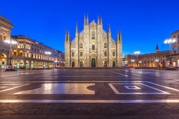 Fototapeta na wymiar Piazza del Duomo, Cathedral Square, with Milan Cathedral or Duomo di Milano, Galleria Vittorio Emanuele II and Arengario, during morning blue hour, Milan, Lombardia, Italy
