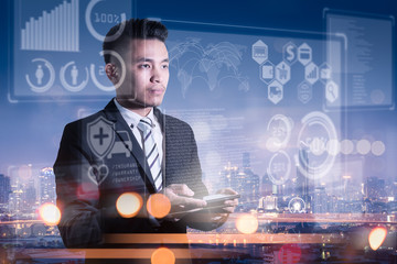 The abstract image of business man point to the hologram on his smartphone and blurred cityscape is backdrop. the concept of communication network, cyber security, internet of things and future life.