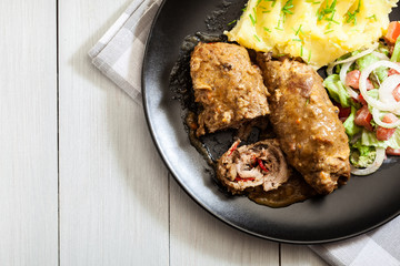 Pork rolls in sauce
