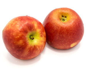 Fototapeta na wymiar Two whole red Kanzi apples isolated on white background