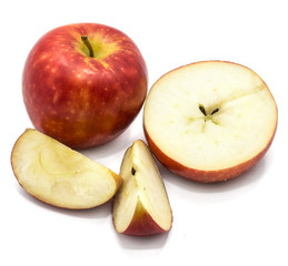 Sliced apples Kanzi, one whole, cross section half, two slices, isolated on white background