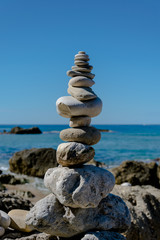 Fototapeta na wymiar I found this balancing act in Greece while walking on a beach. Who did it surely had a steady hand or lots of patience . The funny thing is that the rocks are not glued together .