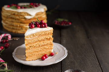 Honey nut ginger and carrot cake decorated with cranberries and rosemary. Perfect Christmas baked...