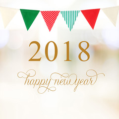Happy New Year 2018 on abstract blur festive bokeh and party bunting flags background, banner