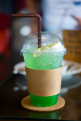 Iced apple soda drink selective focus