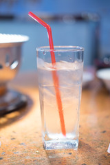 A glass of drinking water with ice.