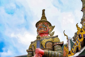 Fototapeta premium Wat Phra Kaew, or the Temple of the Emerald Buddha and Officially as Wat Phra Si Rattana Satsadaram, is regarded as the most sacred Buddhist temple in Bangkok Thailand,symbol Giant statue.