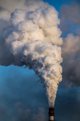 industrial chimney with heavy smoke causing pollution