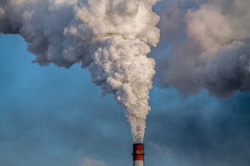 industrial chimney with heavy smoke causing pollution