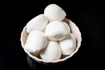 Cheese mozzarella on a black background