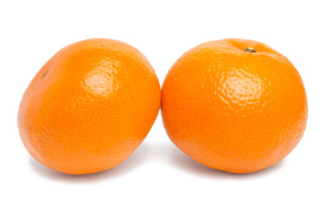 Two ripe fresh juicy tangerine or mandarin isolated on white background