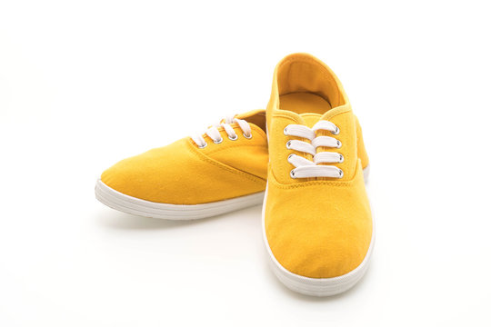 yellow sneakers on white background