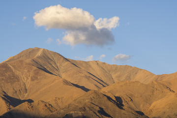 Mountains with clouds background in Ladakh Region, India