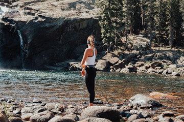 Standing in front of Glen Aulin waterfall in Yosemite National Park
